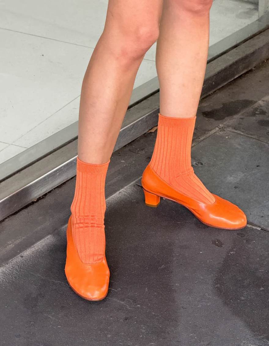 Her Socks in Tangerine